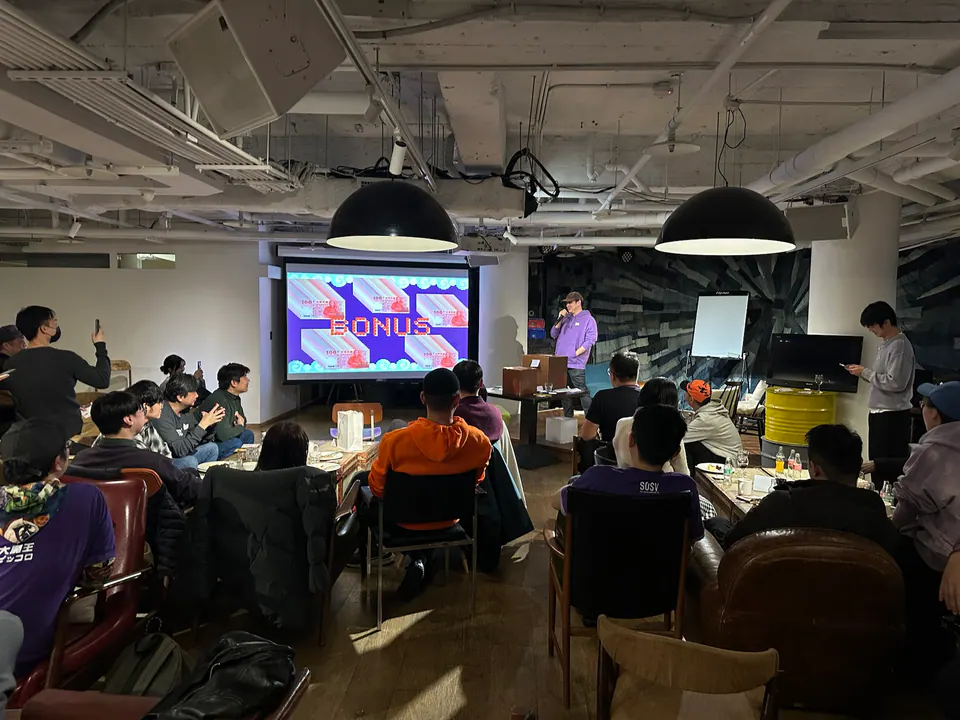 Founders watching a presentation during an 886 Studios community session