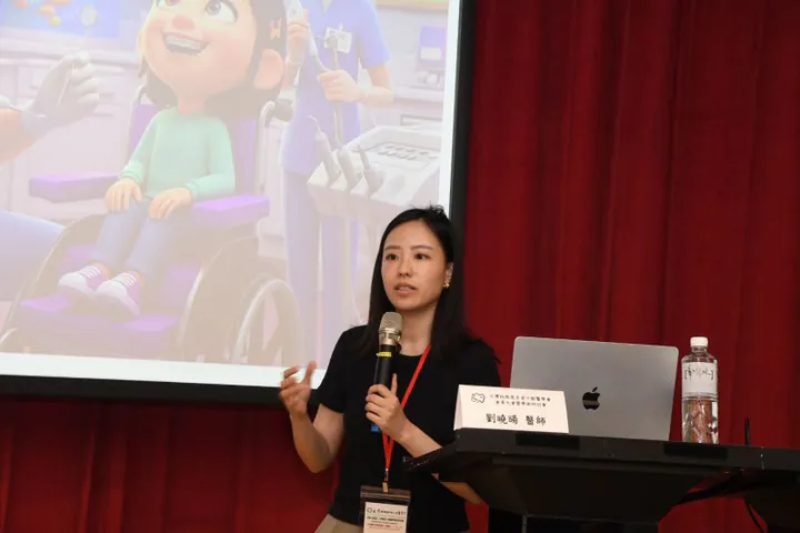 Sylvie Liu speaking at a professional dental event